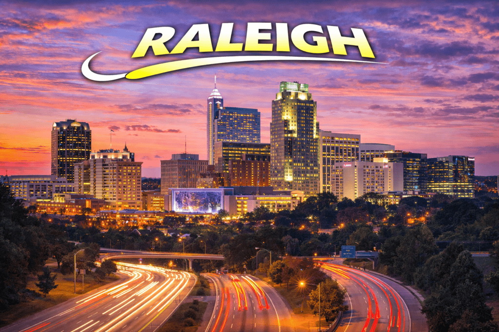 Skyline of Raleigh at sunset with golden sky and city lights for cheap flights travel page
